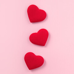 Valentine's Day design concept of red heart on pink background.