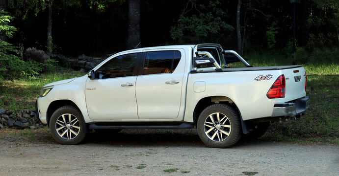 Toyota Hilux 4x4 truck. White truck. All terrain vehicle. Conveyance. Work tool. Cargo vehicle.