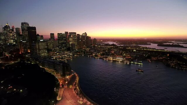 Flying above sydney city in Evning Time. Sydney Opera House with Harbour Bridge. Australia.