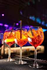 Aperol Spritz cocktail on bar counter in the night club