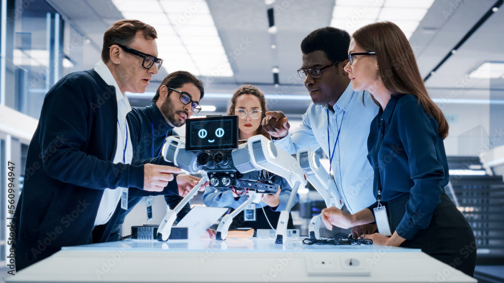 Poster Portrait of a Young Team of Multicultural Engineers Use Computers, Insert a Circuit Board, Analyze and Discuss How a Futuristic Robot Dog Works. High Tech Research Laboratory with Modern Equipment.