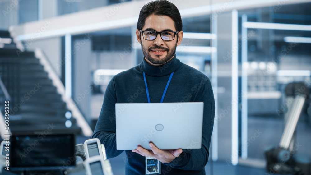 Poster portrait of a professional hispanic man using laptop at work in research and development agency. you