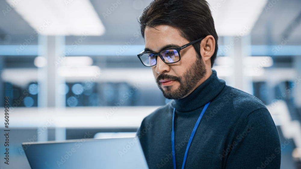 Aufkleber Portrait of a Professional Hispanic Man Using Laptop at Work in Research and Development Agency. Young Multiethnic Male Engineer, Developer or Scientist Working in Development Technology Office.