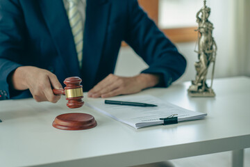 Lawyer office male working with hammer and scales with document, contract, legal adviser concept.