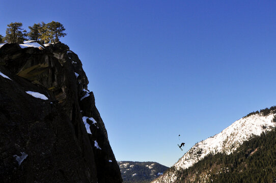 Pro skier Josh Daiek performs a double backflip ski BASE jumping off of Lovers Leap in Strawberry, CA.