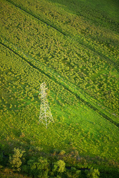 Aerial image of a tower holding high-tension power transmission lines outside Hendersonville, NC
