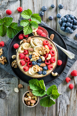 Smoothie Bowl with Berries, Banana, Nuts, and Oats – Healthy Vegan Breakfast or Snack