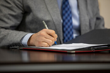 businessman signing a document