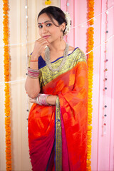 Indian woman posing in saree - Celebrating  Diwali festival in traditional Indian dress. Confident Indian woman wearing a saree and posing for the camera - Indian traditional dress on Diwali festival 