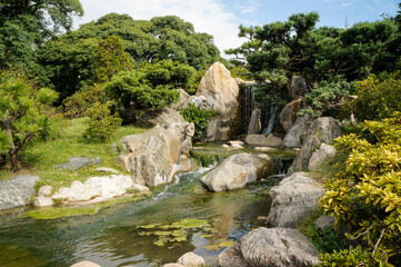 Fototapeta na wymiar Waterfall at the Japanese Garden in Buenos Aires, Argentina.