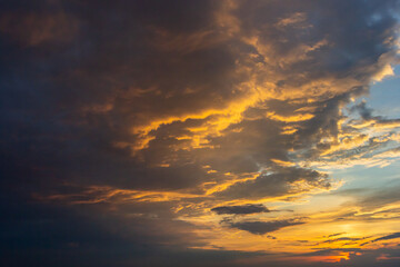 sunset sky with multicolor clouds. Dramatic twilight sky background