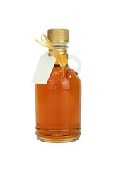 Maple syrup bottle with gift tag isolated on white background.  Cutout jug of maple syrup with gift tag.  