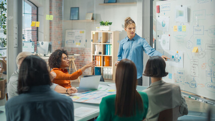 Beautiful Female Manager Holding a Meeting in a Conference Room at a Creative Agency Office....