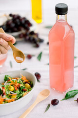 various salad vinegars in glass bottles. Front and top view. apple, lemon, strawberry, quince, grape, melon, apricot, tangerine, orange, grapefruit,