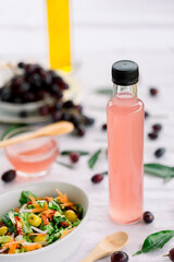 various salad vinegars in glass bottles. Front and top view. apple, lemon, strawberry, quince, grape, melon, apricot, tangerine, orange, grapefruit,