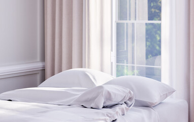 Fototapeta na wymiar Bed with white bedding in elegant hotel or apartment bedroom