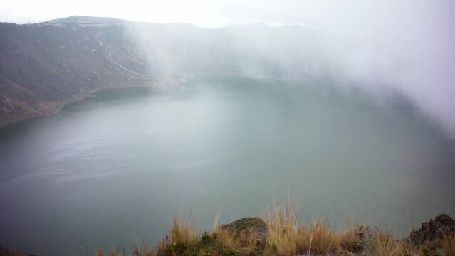 fog over the volcanic lake Quilotoa in Ecuador in South America