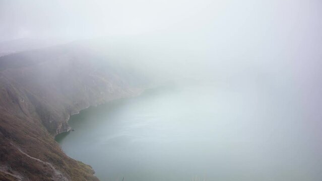 fog over the volcanic lake Quilotoa in Ecuador in South America