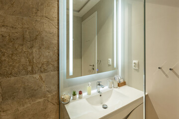 Fototapeta na wymiar Bathroom interior with glass shower cabin
