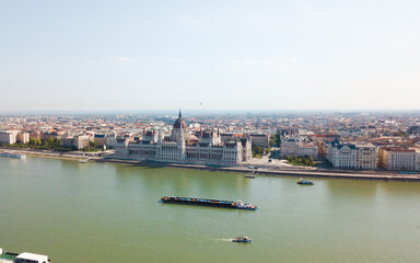 Obraz premium Beautiful landmarks and buildings in Budapest, Hungary. The hungarian parlament building and fishermans castle. Nice drone shots of the city.