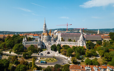 Fototapeta na wymiar Beautiful landmarks and buildings in Budapest, Hungary. The hungarian parlament building and fishermans castle. Nice drone shots of the city.