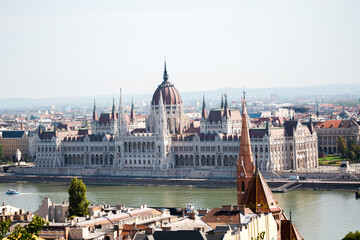 Fototapeta premium Beautiful landmarks and buildings in Budapest, Hungary. The hungarian parlament building and fishermans castle. Nice drone shots of the city.