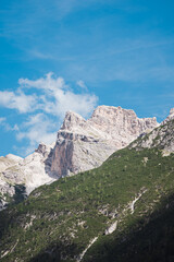 Amazing mountain cliffs viewed from Lago di Dobbiaco - The dolomites - Italy