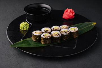 Sushi Maki With Avocado on black plate