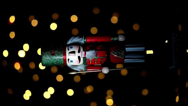 Christmas nutcracker with Christmas tree in background