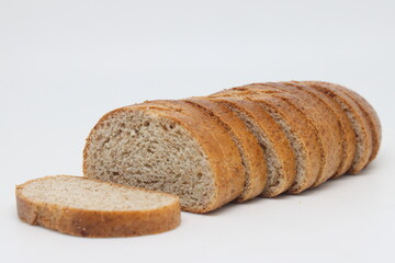 Loaf of bread, cut into slices, fresh bread.