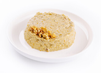 Oatmeal porrige in white plate isolated