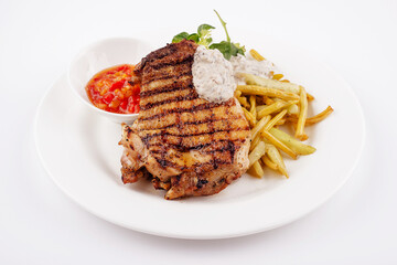 Grilled steak with asparagus on white plate