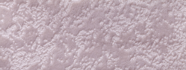Texture of light pink velvet background from upholstery textile material. Abstract beige velour fabric with pattern