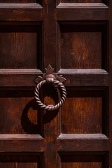 Fotobehang Ancient old doorn knocks in San Gimignano © Adi Seres
