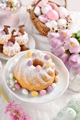 Sweet pastries on Easter table in pastel colors