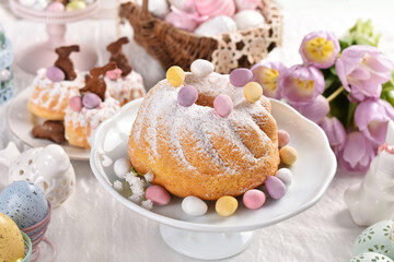 Sweet pastries on Easter table in pastel colors