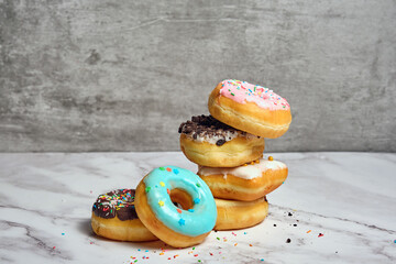 a stack of various donuts
