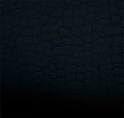 black background of crocodile skin illuminated by light