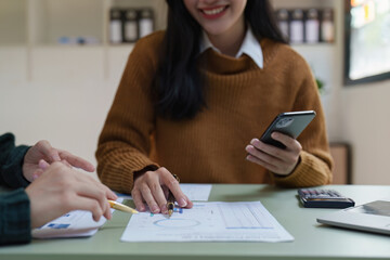 Asian business advisor meeting to discuss and analyze and the situation on the financial report in the meeting room. Fund Investment and accounting concept