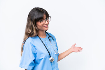 Young caucasian nurse woman isolated on white background extending hands to the side for inviting to come