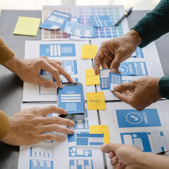ui designer brainstorming about mobile app interface wireframe design with customer breif and color...