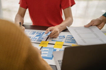 ui designer brainstorming about mobile app interface wireframe design with customer breif and color...