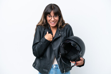 Young caucasian woman with a motorcycle helmet isolated on white background with surprise facial...