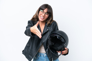 Young caucasian woman with a motorcycle helmet isolated on white background shaking hands for closing a good deal