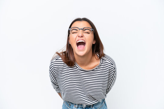 Young caucasian woman isolated on white background shouting to the front with mouth wide open