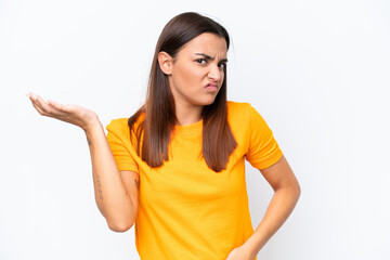 Young caucasian woman isolated on white background having doubts