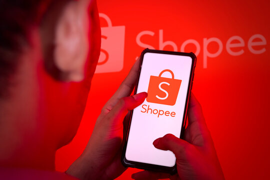 pringsewu, Lampung; January 13, 2023; Hands close up. This photo illustration displays the shopee logo on a cellphone screen. clippingpath