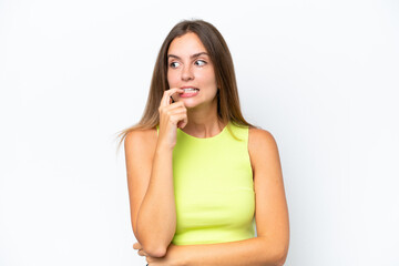 Fototapeta premium Young caucasian woman isolated on white background nervous and scared
