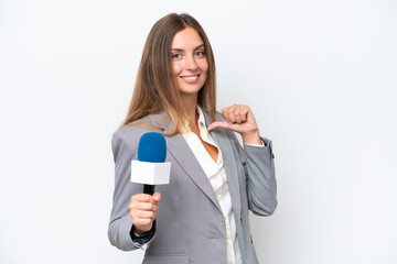 Fototapeta premium Young TV presenter caucasian woman isolated on white background proud and self-satisfied
