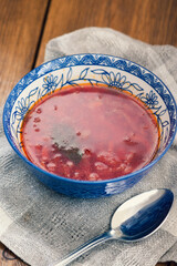 A plate of borscht with sour cream